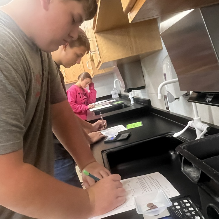 Physical science students perform their first lab of the year.