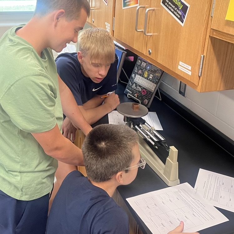 Physical science students perform their first lab of the year.