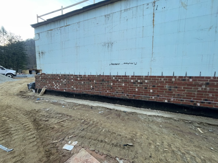 Photos of brick being laid