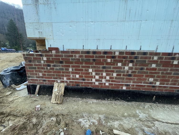 Photos of brick being laid