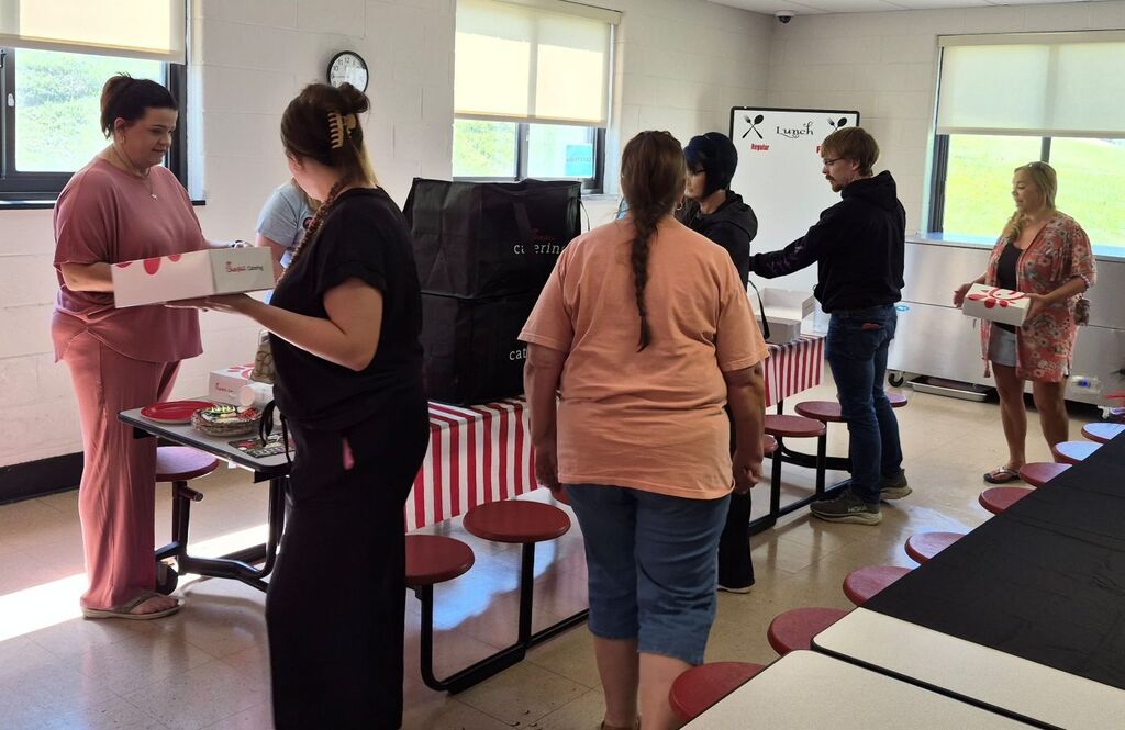 Staff picking up their Chick-fil-A boxed lunches provided by First Community Bank
