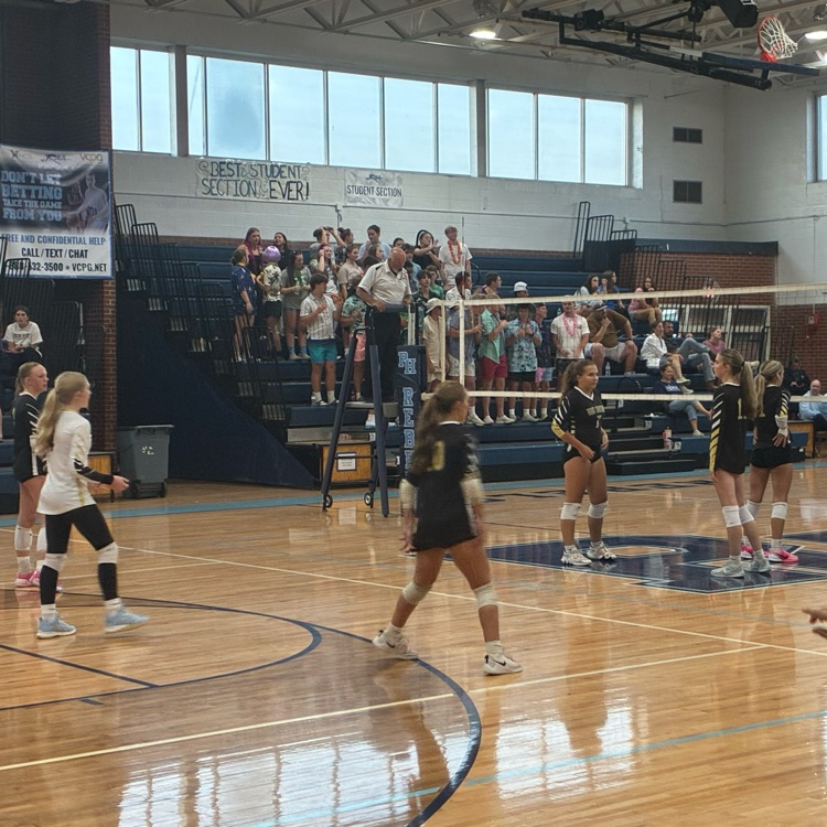 The team gets in position to receive the next serve