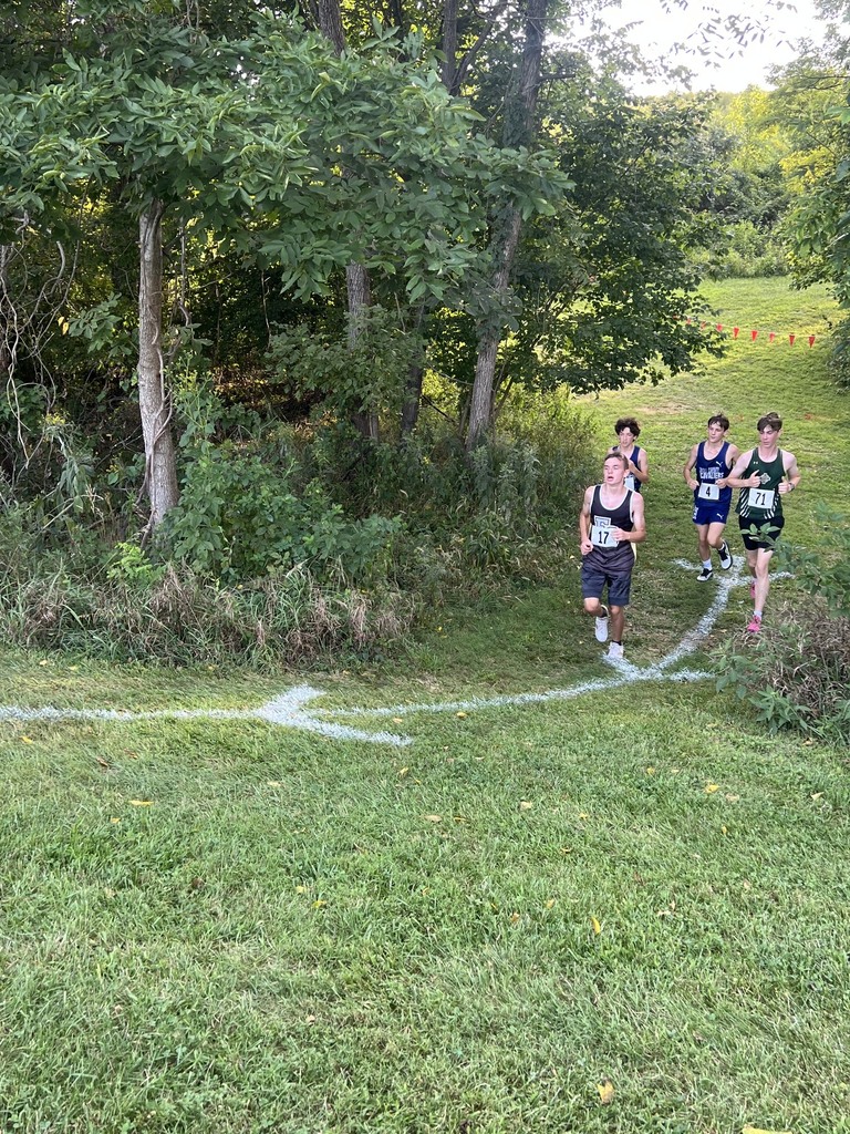 A Fort Chiswell male runner takes the lead in front of 3 other runners.