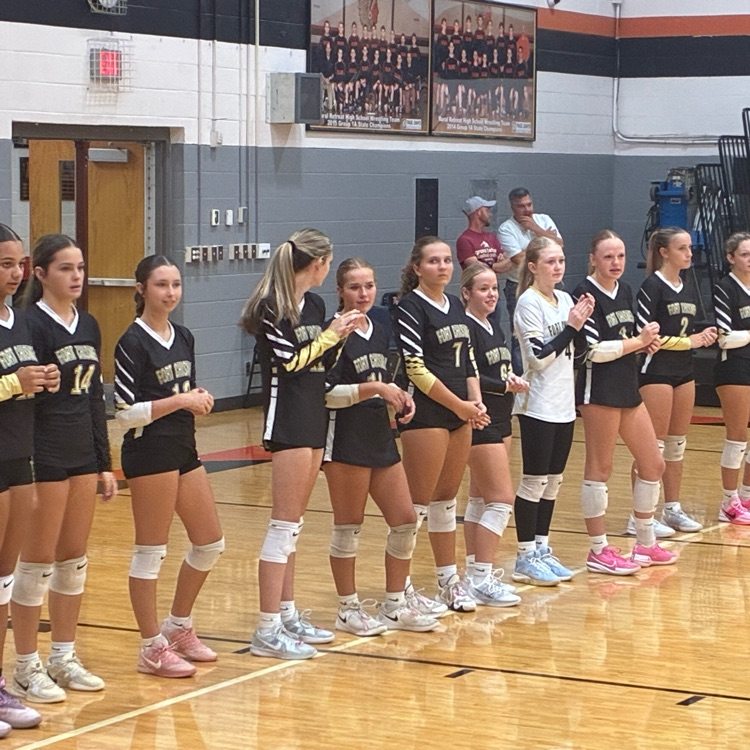 The varsity team lines up on the back line as they wait to be introduced.