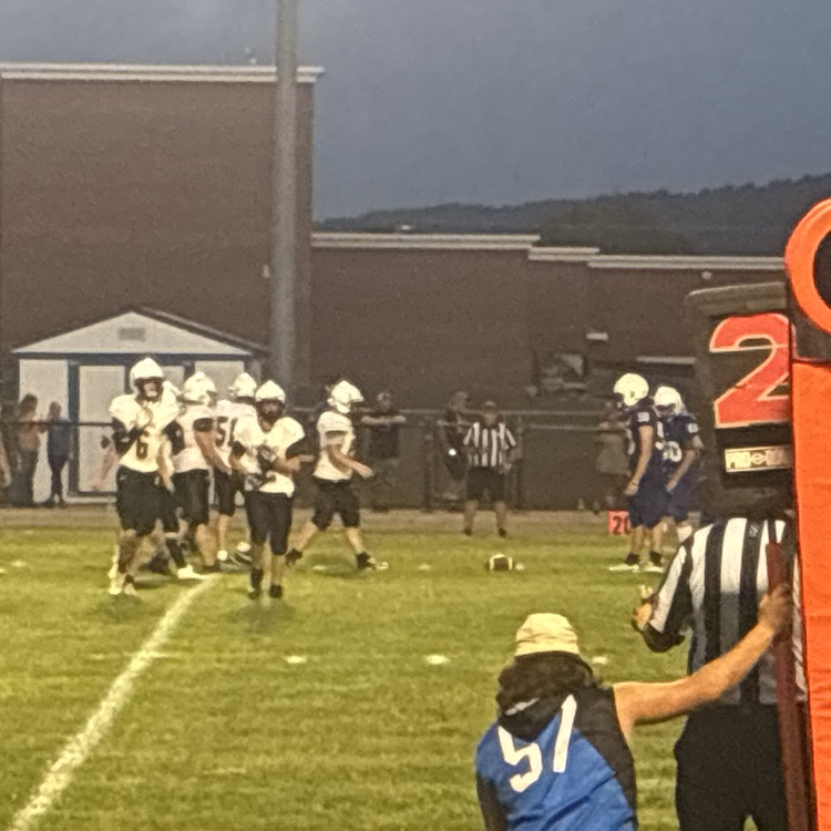 Football players get ready for the second down.