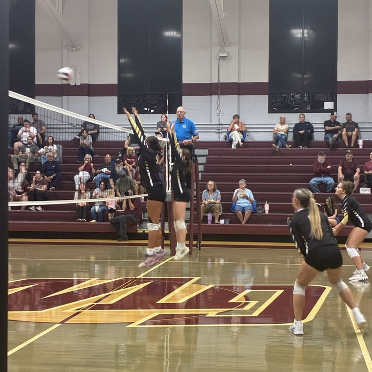 two front row players jump up to block on the net