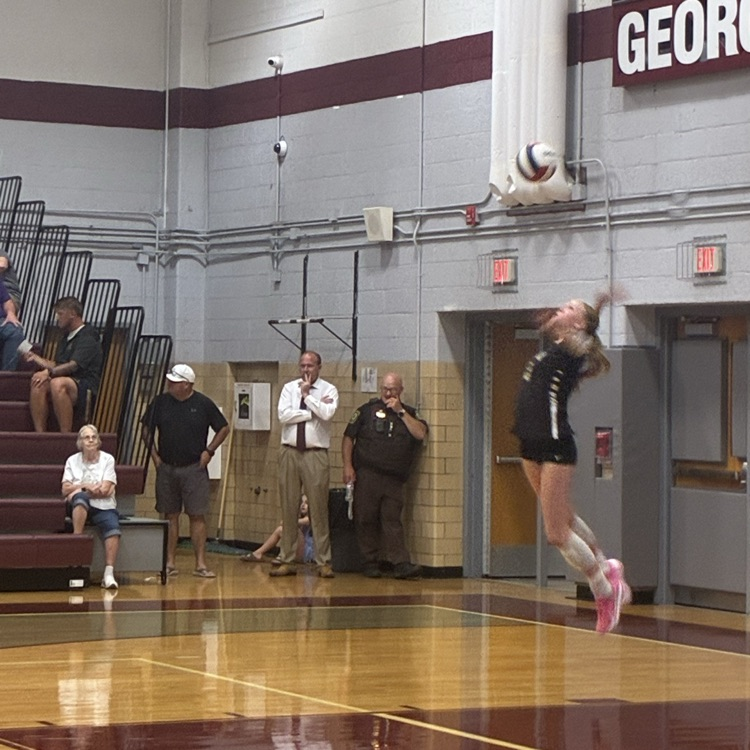 a powerful jump serve in action