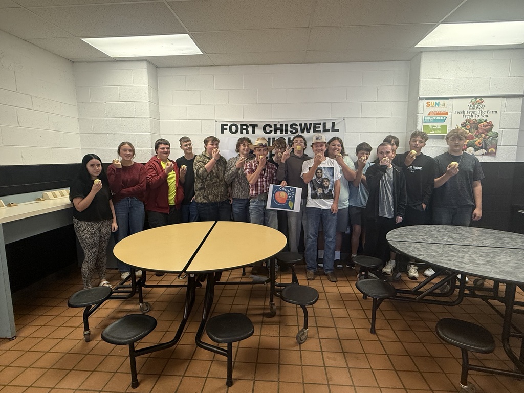 FCHS students biting their apples.