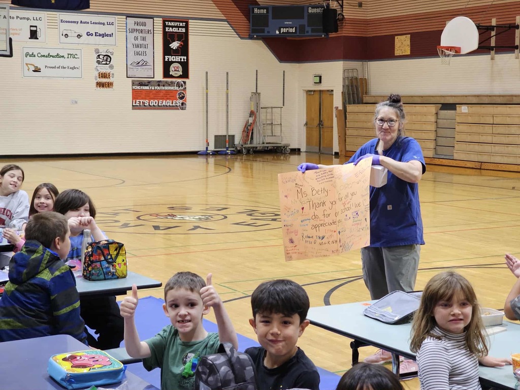Students cheer on Ms. Betty at lunch.
