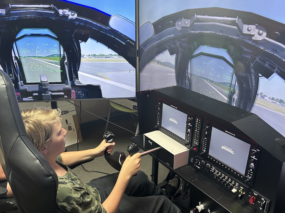 boy in flight simulator