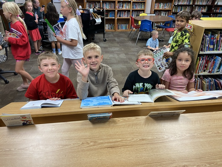 Mrs. Krommenhoek’s second grade class loves discovering new books in the library!
