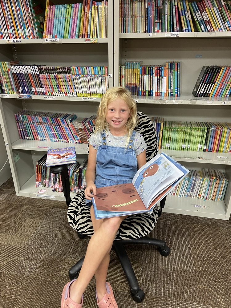 Mrs. Krommenhoek’s second grade class loves discovering new books in the library!