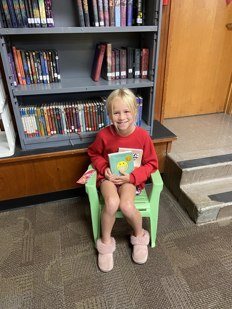 Mrs. Krommenhoek’s second grade class loves discovering new books in the library!