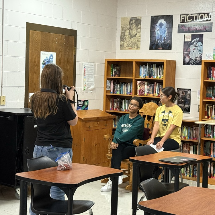 YMS Happenings reporters interview a band member. 