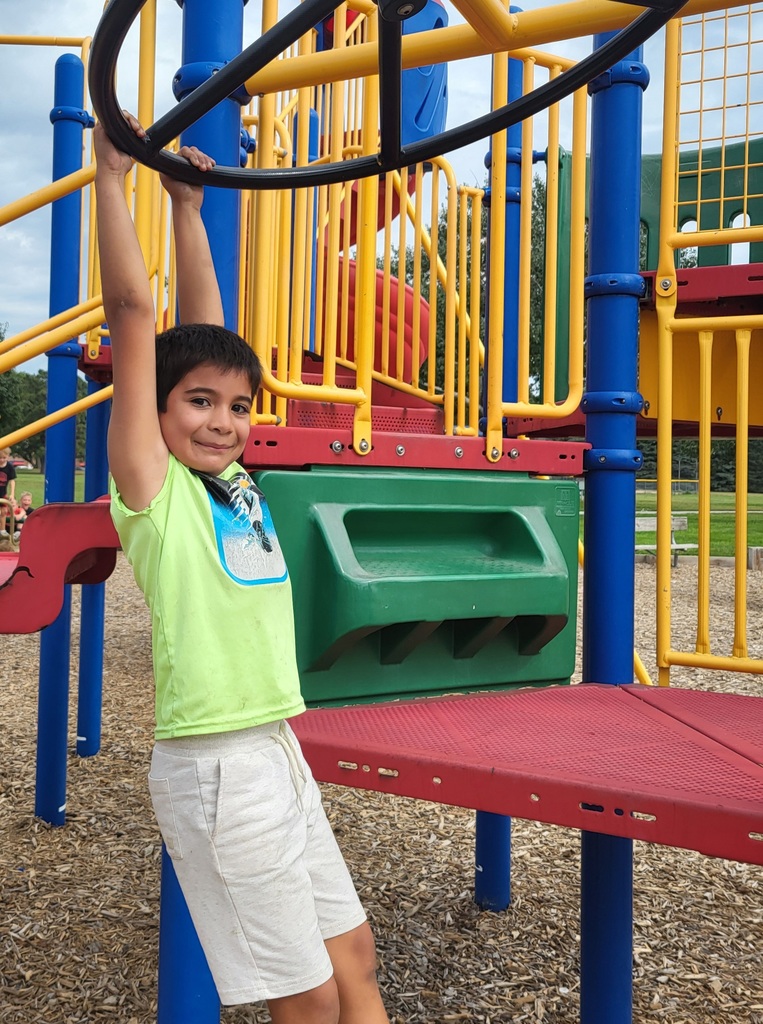 Boy hanging on wheel