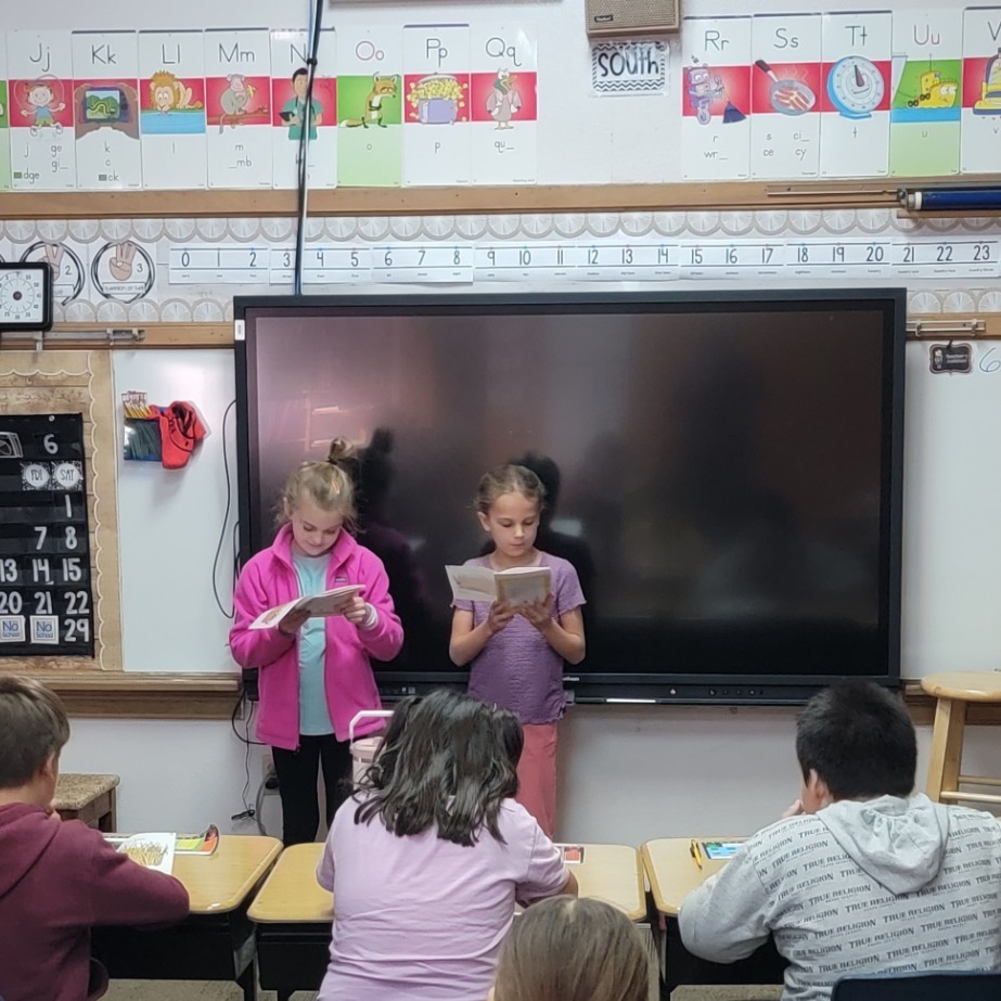 Students practicing reading fluency.