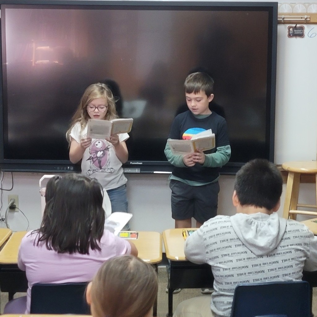 Students practicing reading fluency.