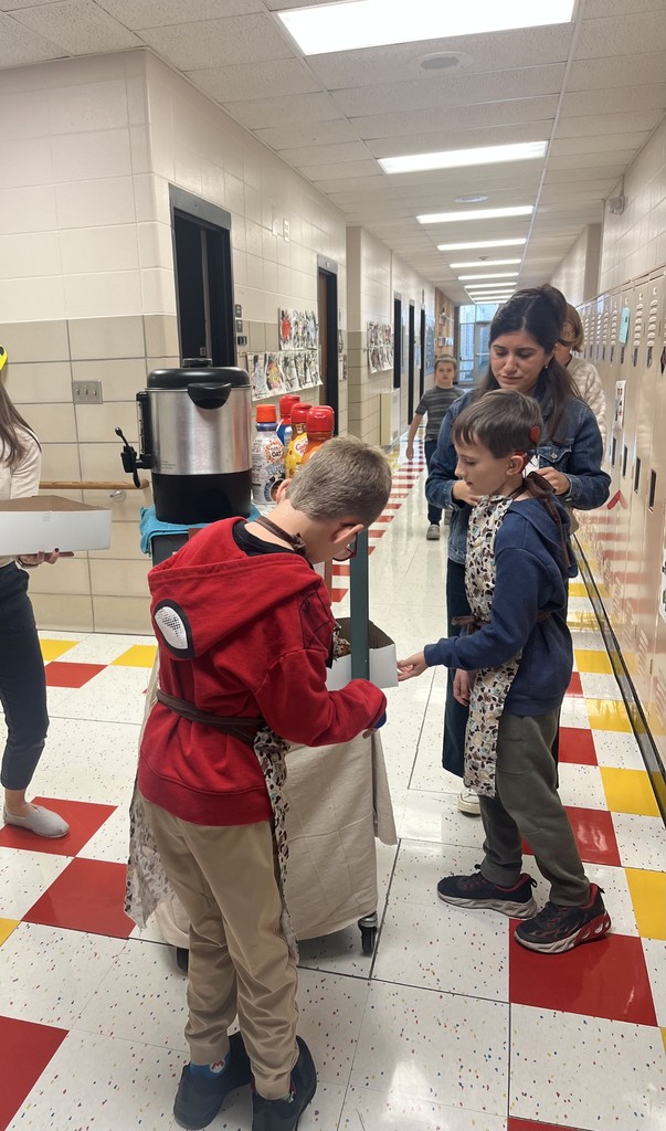 Coffee Cart workers delivering donuts and coffee to staff