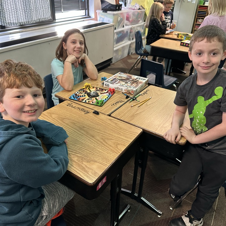 kids playing board and card games 