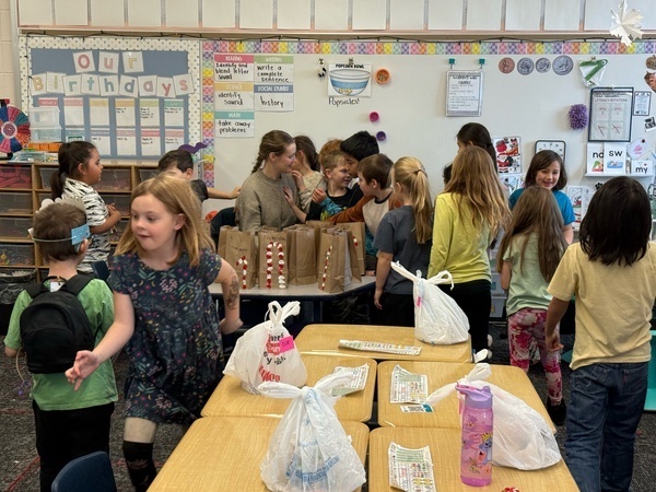 Students are giving Eva hugs and cards