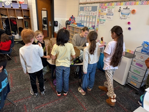 Students are giving Eva hugs and cards