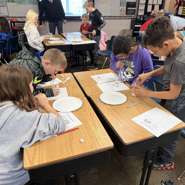 Mrs. Lukkes's fourth grade class at Beadle enjoyed being scientists and learning about volcanoes. They did an experiment to learn the difference between cone volcanoes and shield volcanoes.  