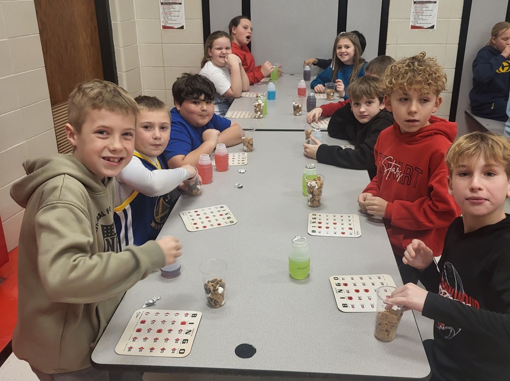 Kids at lunch table playing bingo