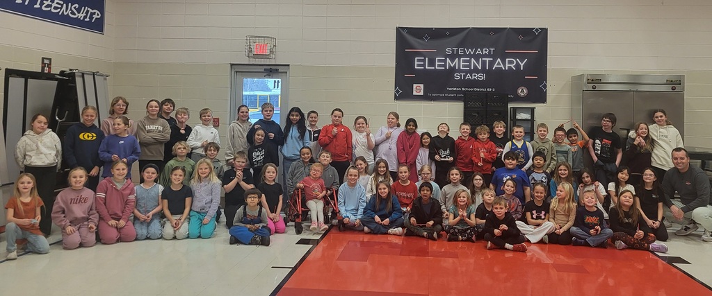 large group of students seated and standing
