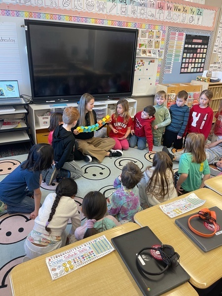 students with teacher for kindness lesson