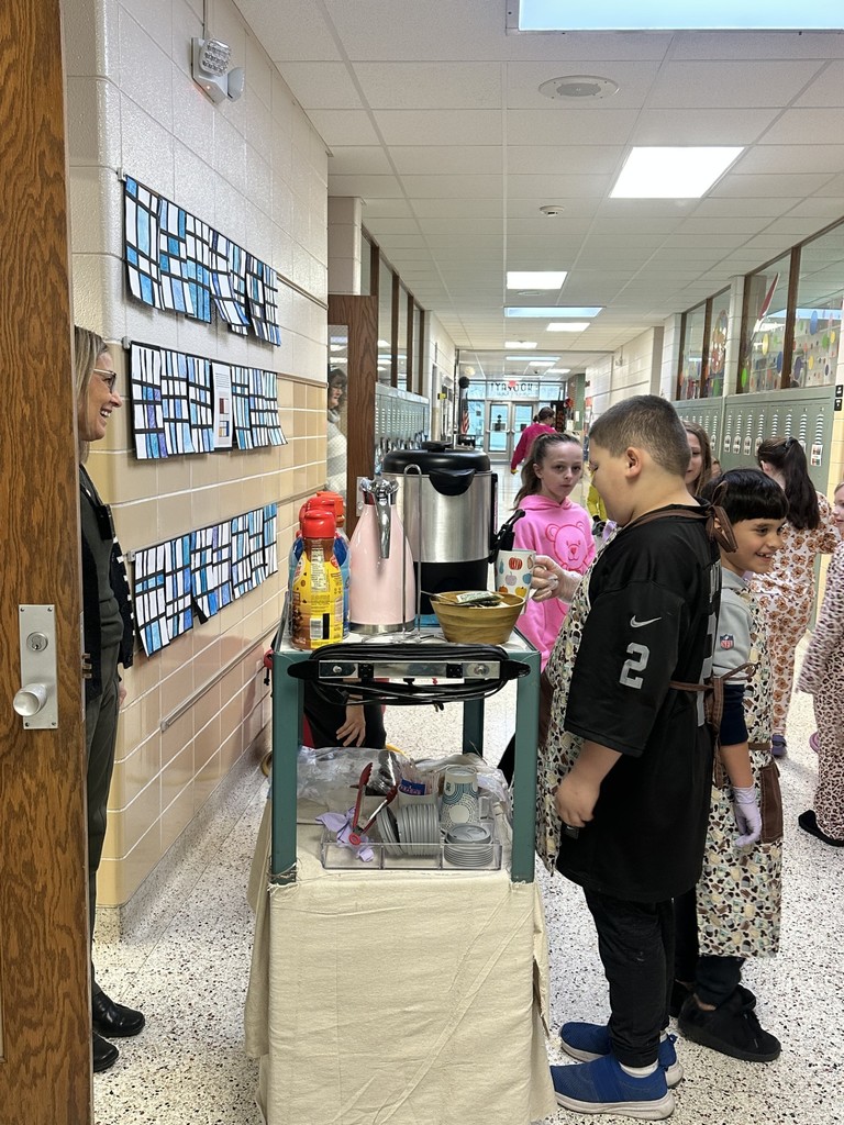 coffee cart workers at 3rd grade classroom