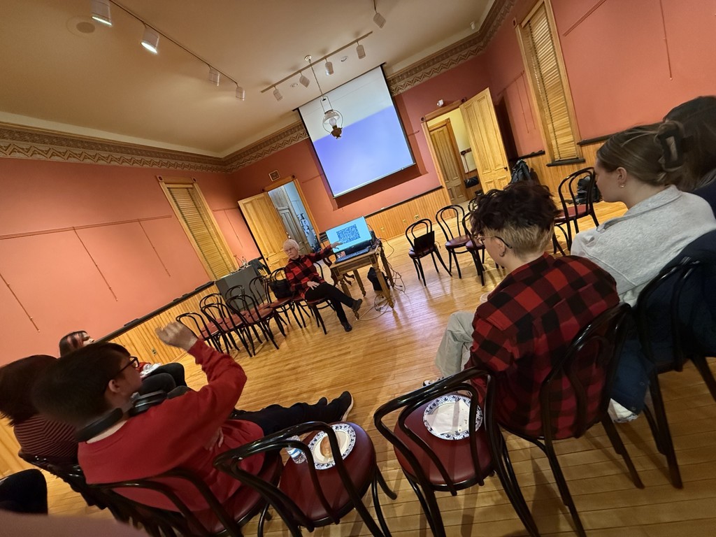 Retired YSD teacher and bird photographer, Sharon Koller, speaks to students.