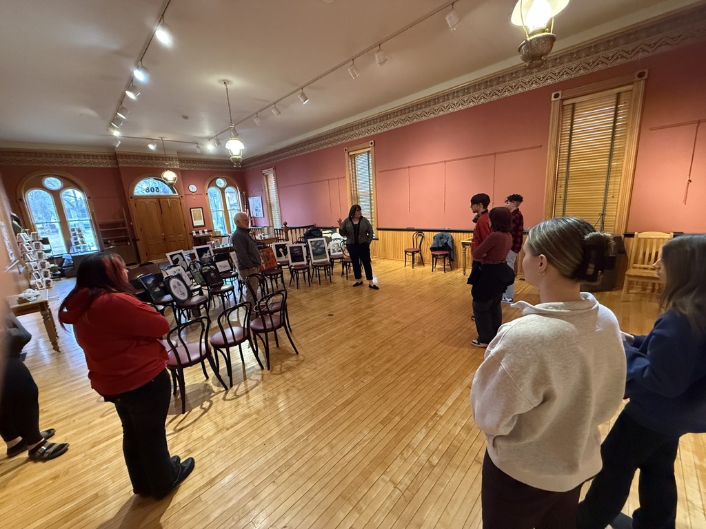 YHS AP Art students prepare to hang the show.