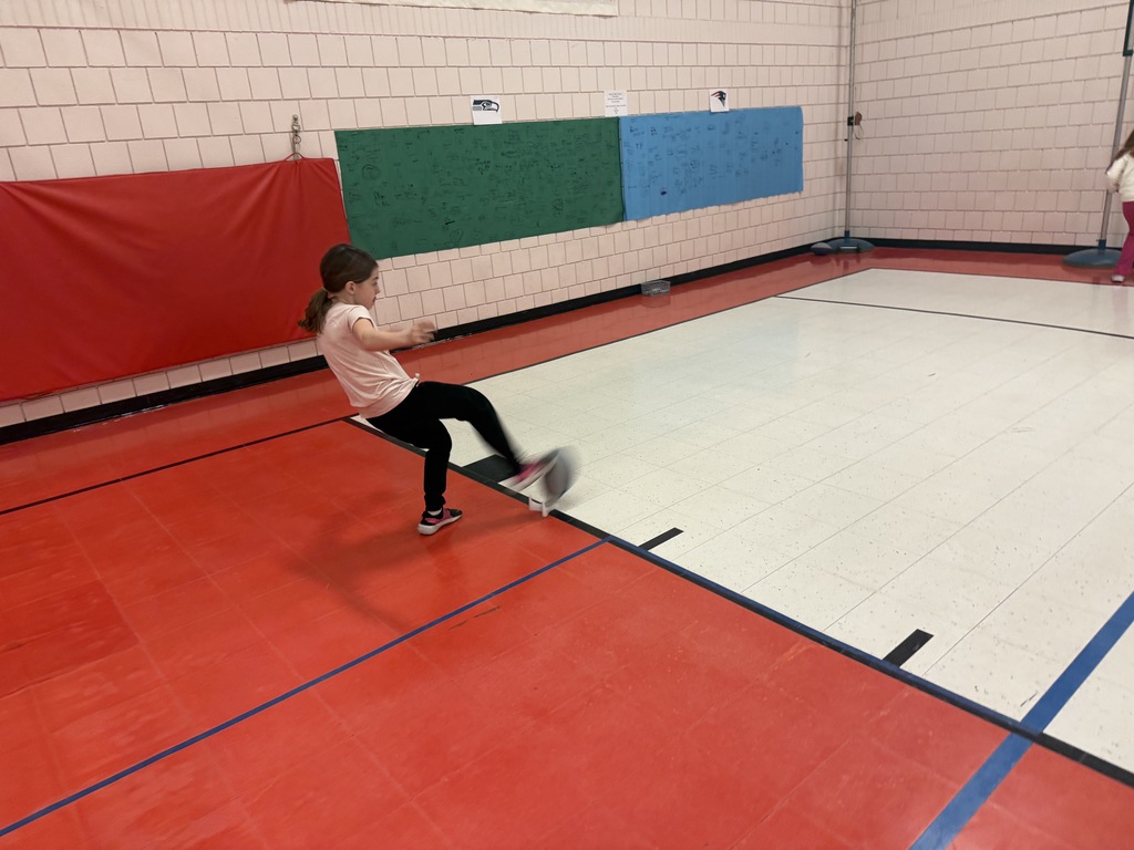 Student kicking a football