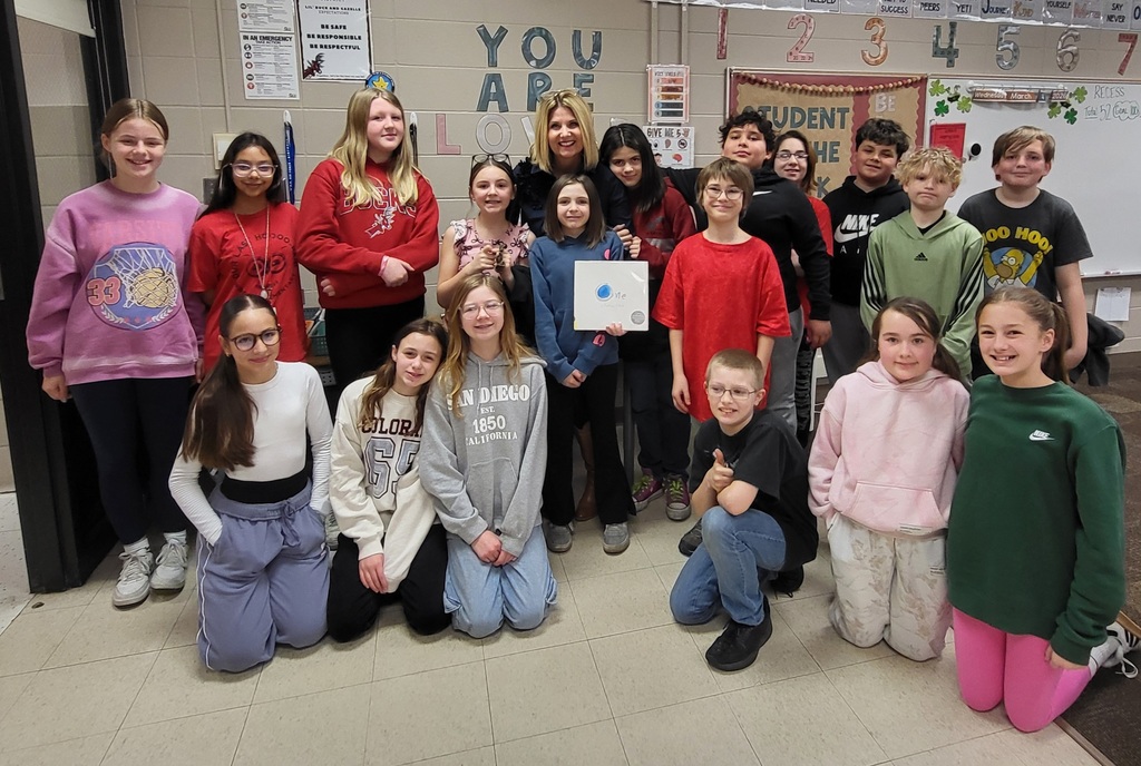 large group of students around teacher