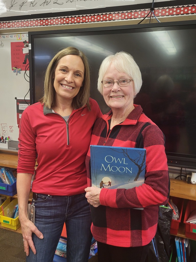 teachers sided by side with book