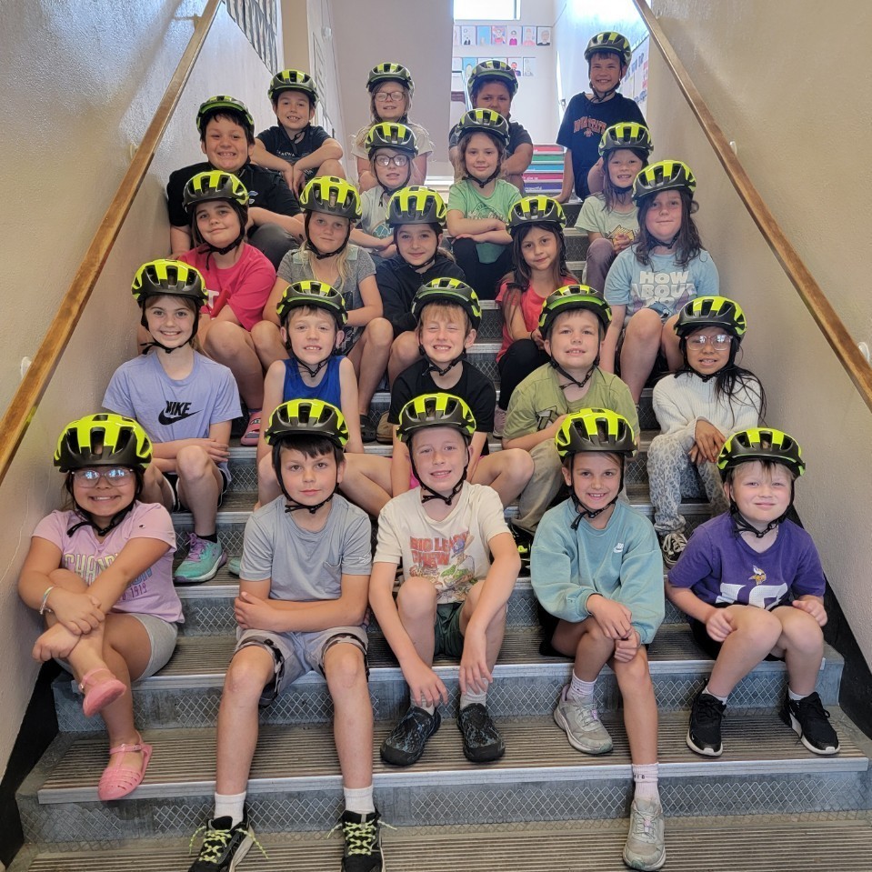 Students in helmets. 