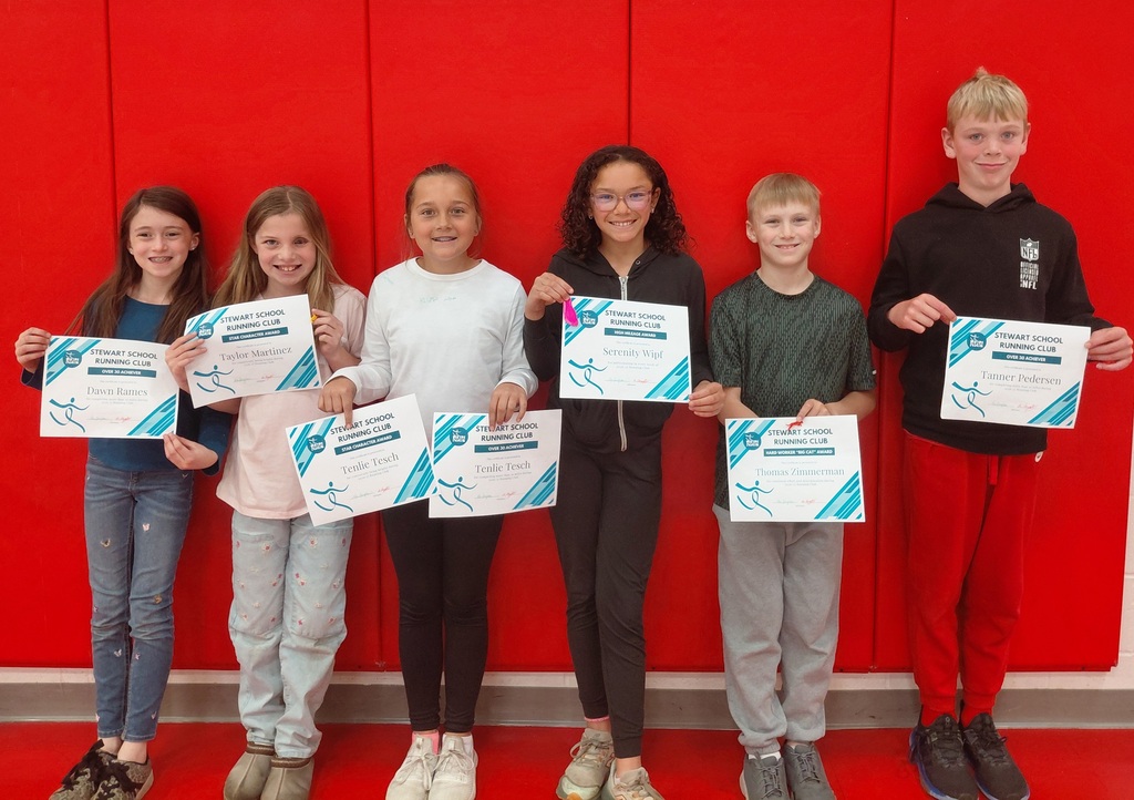 students standing and holding certificates
