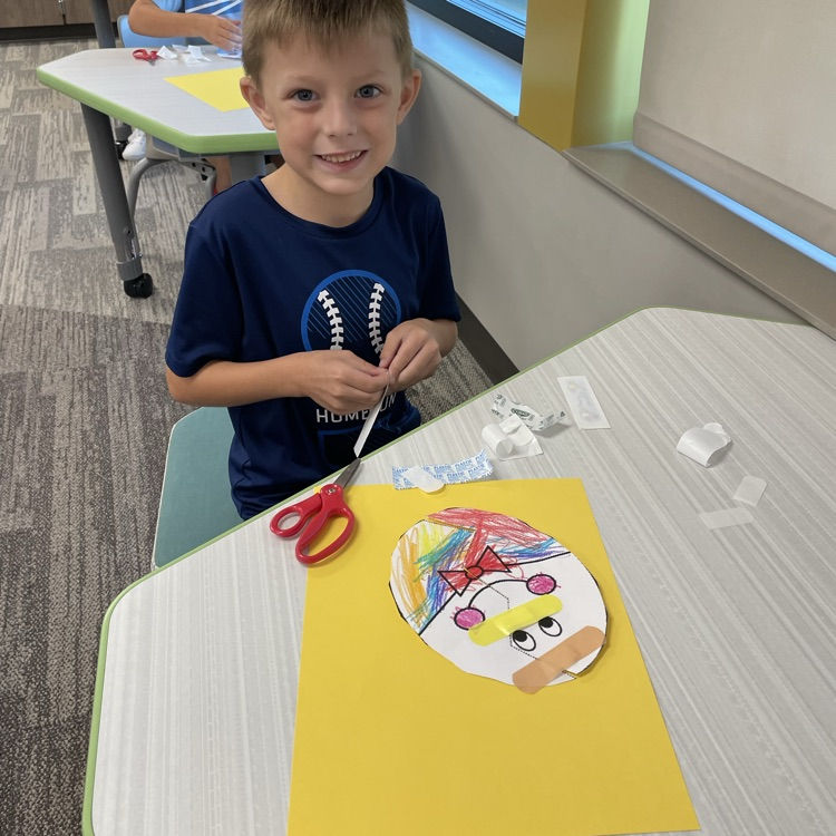 boy helping craft