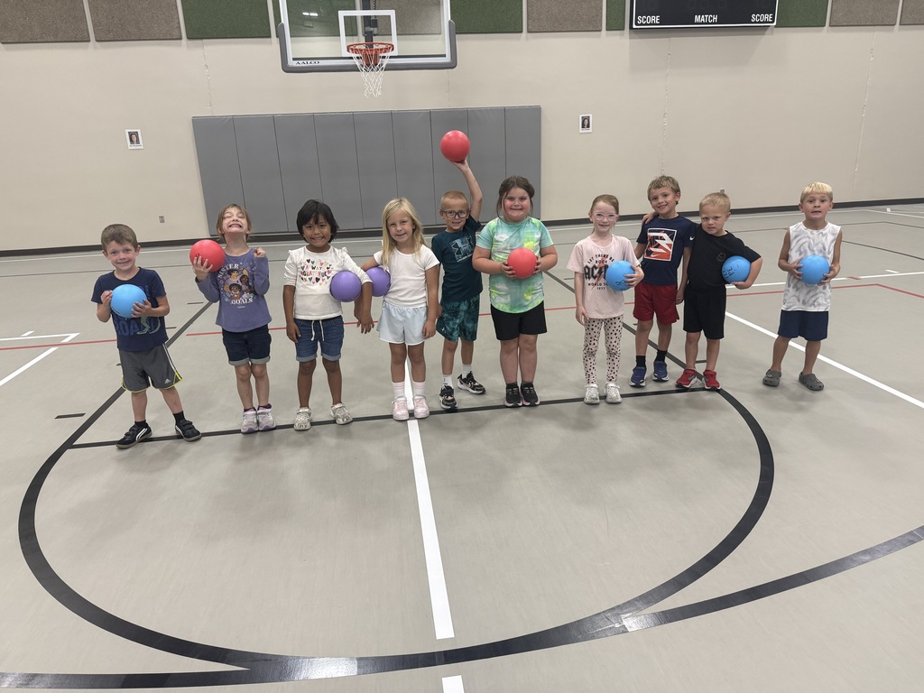 Students holding basketballs