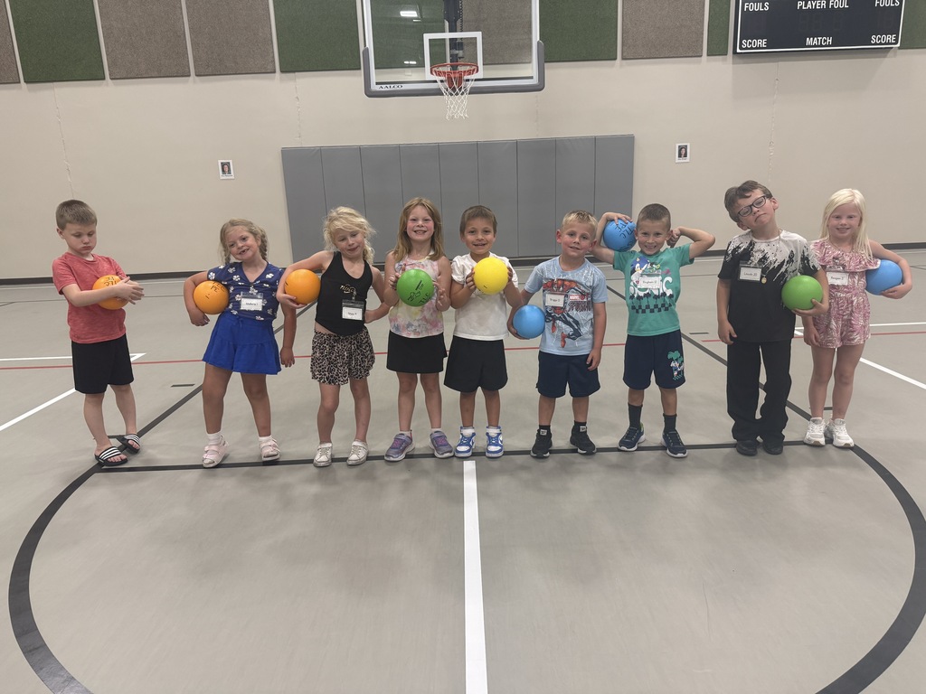 Students holding basketballs