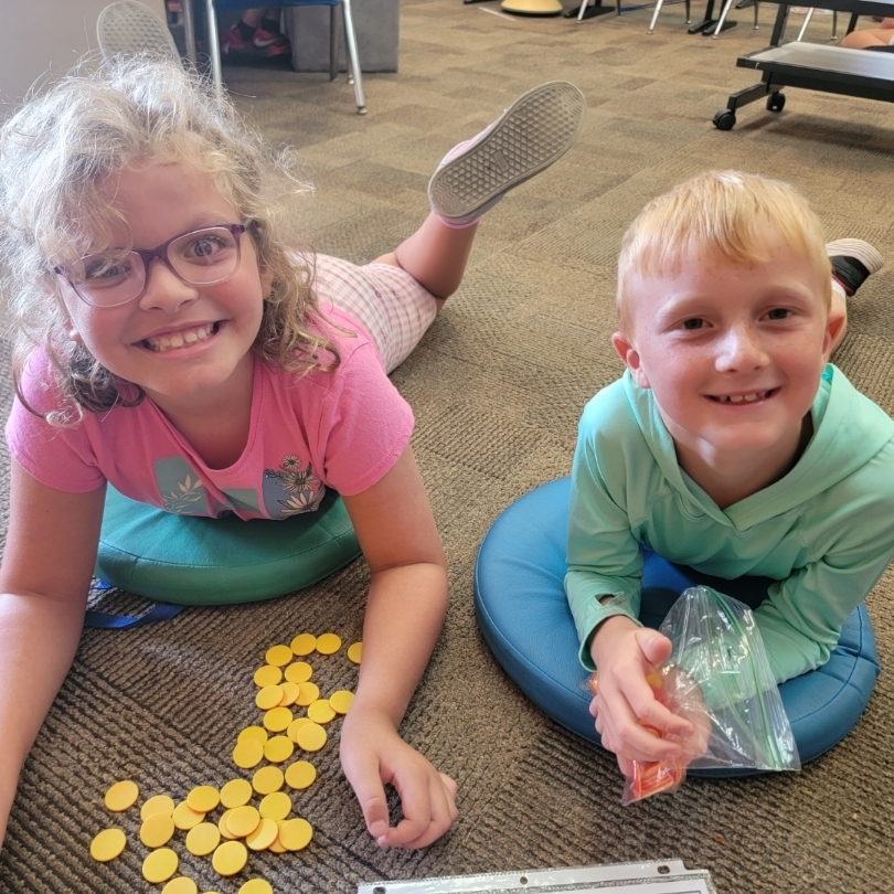 Students practicing math game.