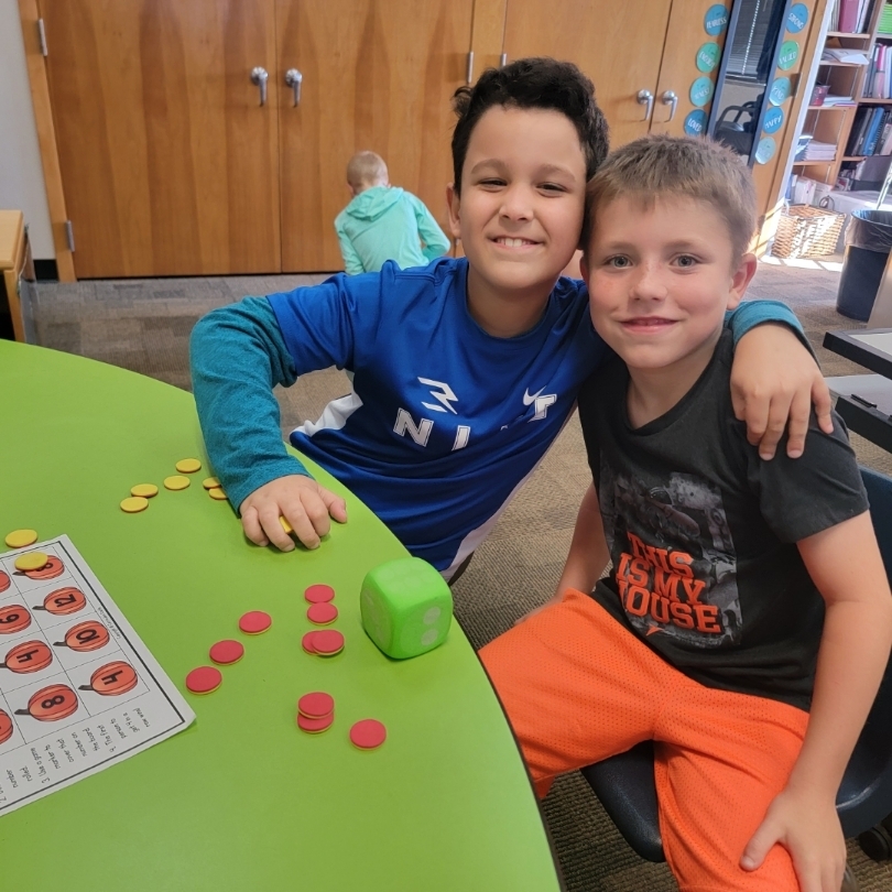 Students practicing math game.