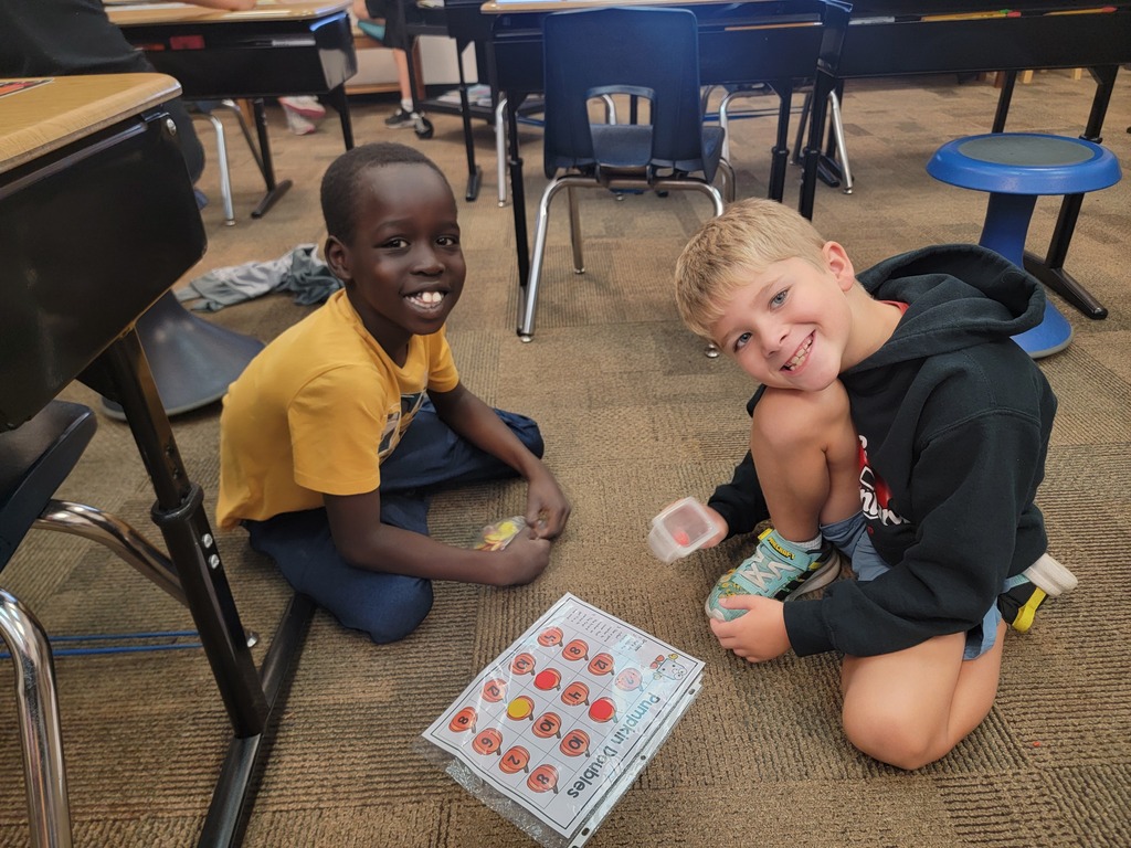 Students practicing math game.