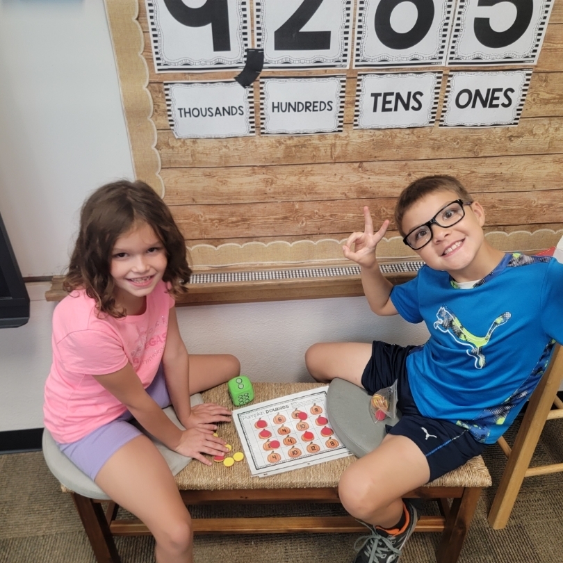 Students practicing math game.