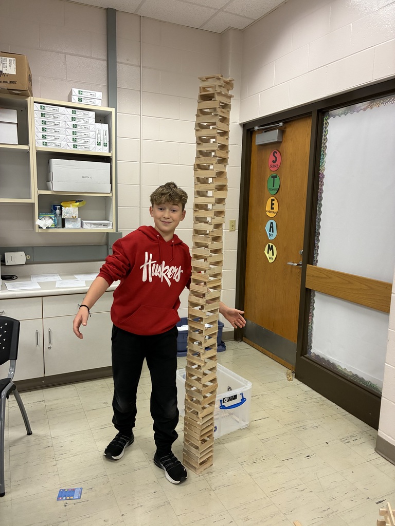 students building towers with KEVA planks in STEM