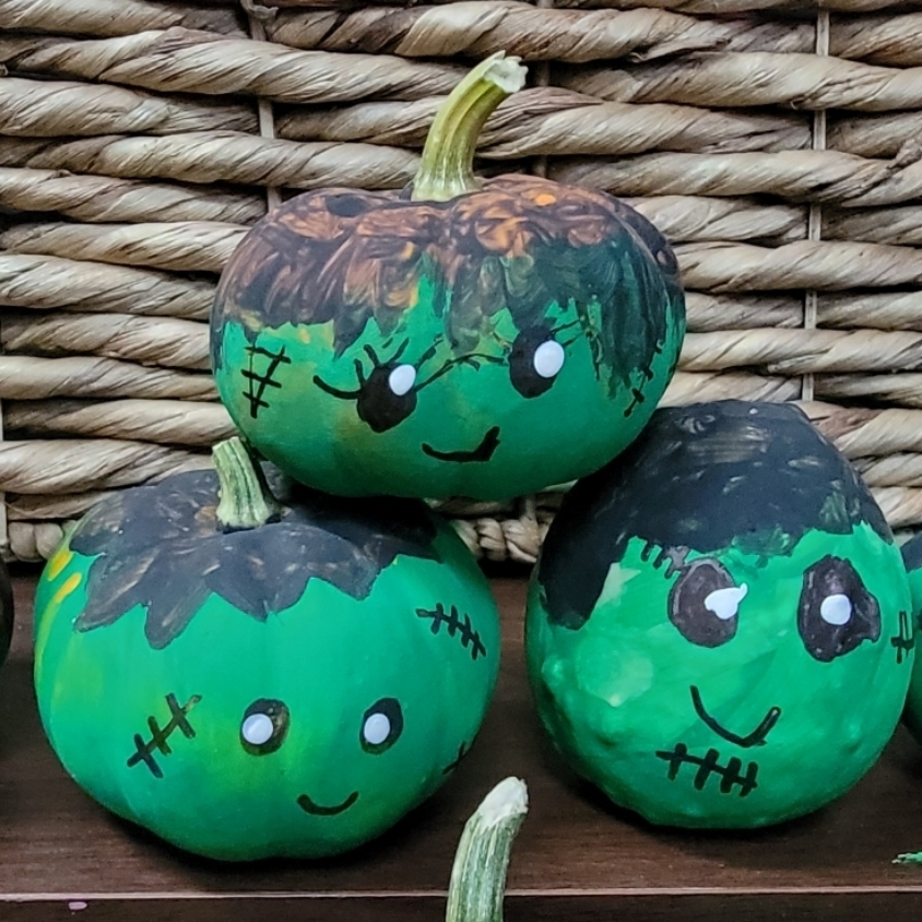Pumpkins painted to look like Frankenstein. 