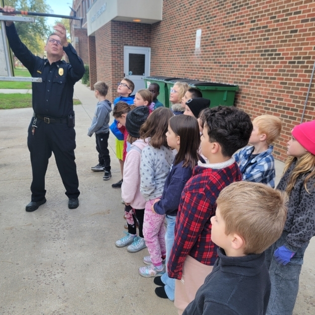 Students listening to fire safety.