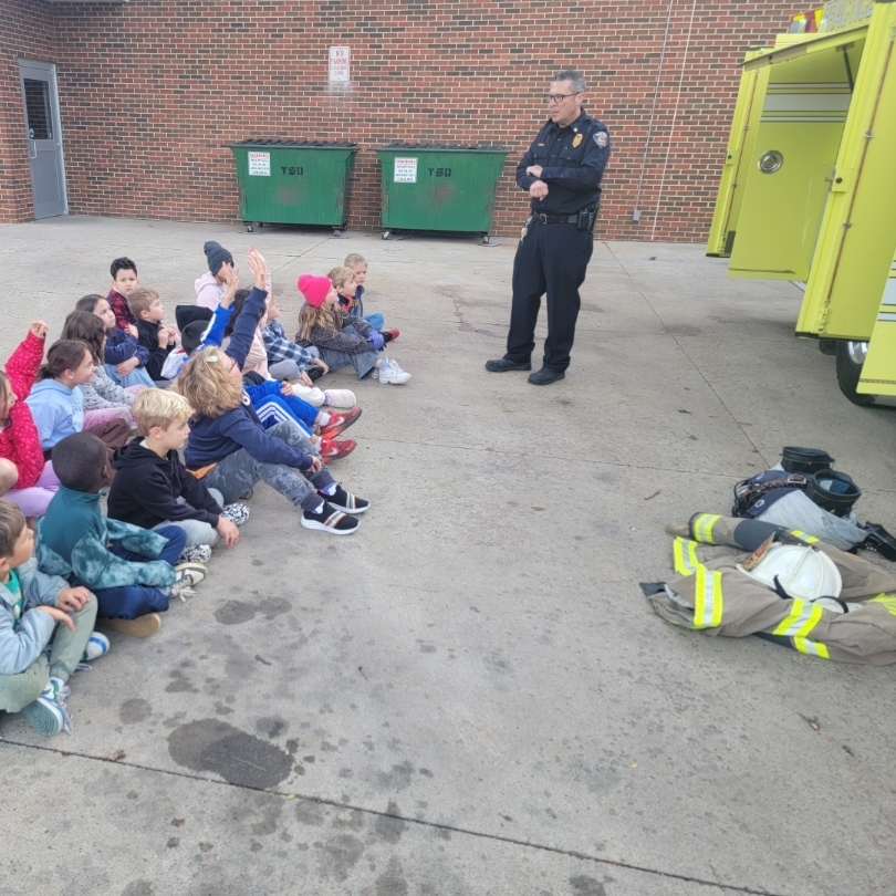 Students listening to fire safety. 