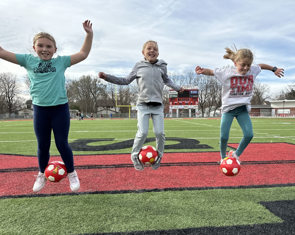 Students playing soccer