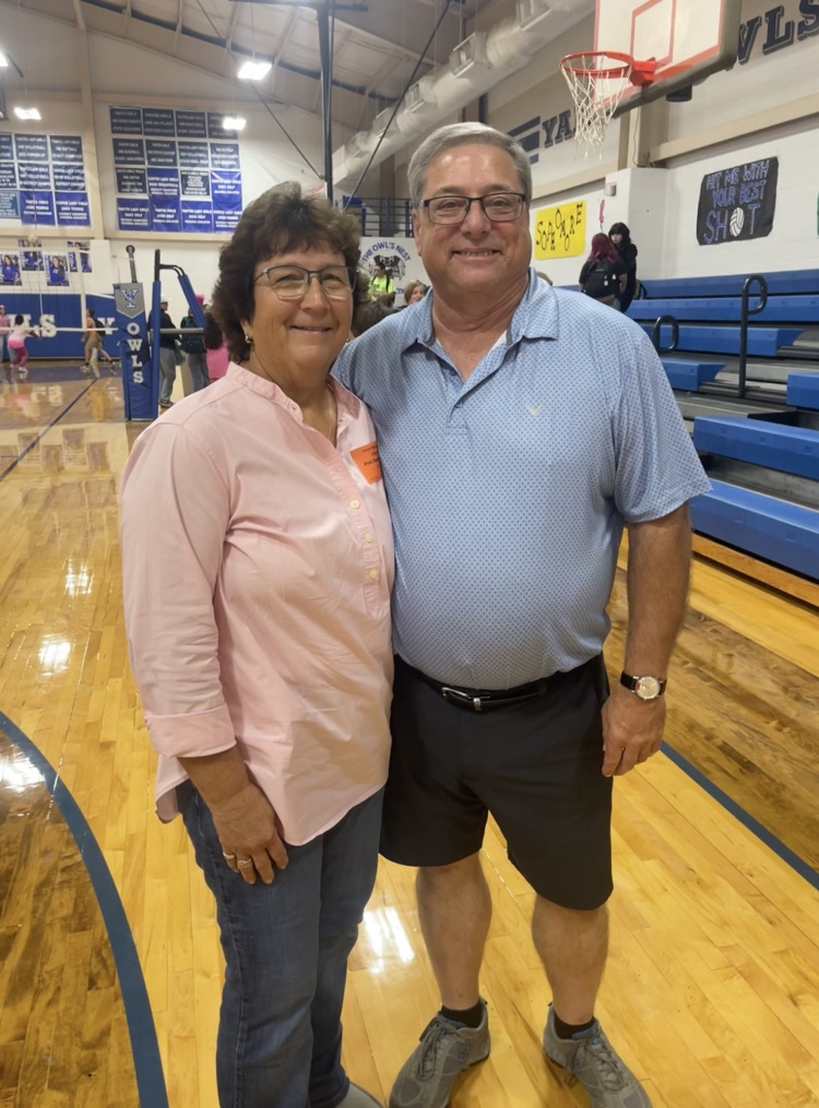 superintendent and wife enjoying game